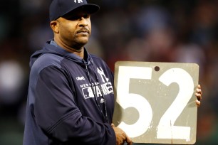 CC Sabathia of the New York Yankees is presented with a Green Monster plaque at Fenway Park.