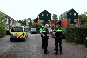 Police officers are seen at the scene of a shooting in Dordrecht, Netherlands.