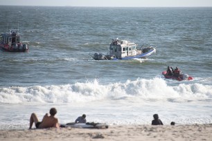 NYPD and FDNY divers and rescue swimmers search the water for the missing teens