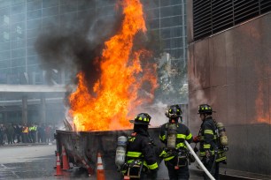 Firefighters battle a dumpster fire near 4 South Street.