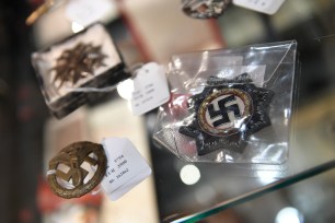 Exhibits from the Nazi era are seen in a cupboard at the auction house Hermann Historica in Munich, Germany