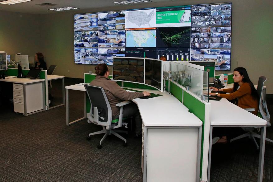 Paycom personnel monitor physical and IT security in the command center at the Oklahoma City Paycom campus.