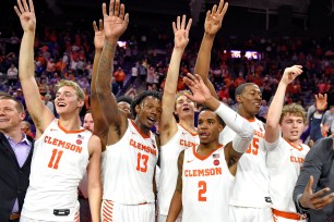 Clemson players celebrate after their 79-72 upset win over Duke on Tuesday night.