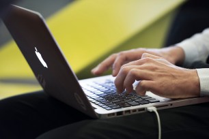 Note-taking on a computer during a business meeting: someoneÕs hands typing on a keyboard (Photo by: Andia/Universal Images Group via Getty Images)