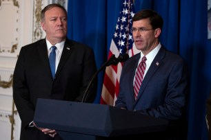 Secretary of State Mike Pompeo, left, listens as Secretary of Defense Mark Esper delivers a statement on Iraq and Syria.