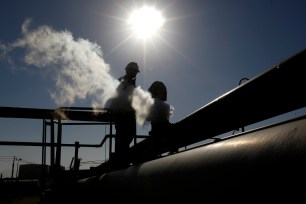 A Libyan oil worker, works at a refinery inside the Brega oil complex, in Brega, eastern Libya.