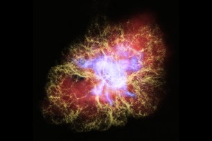 This new multiwavelength image of the Crab Nebula combines X-ray light from the Chandra X-ray Observatory (in blue) with visible light from the Hubble Space Telescope (in yellow) and infrared light seen by the Spitzer Space Telescope (in red).