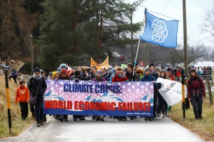 Climate activists start for an 18-mile hike to the Alpine resort of Klosters, to highlight issues surrounding climate change at the World Economic Forum Davos (WEF), in Landquart, Switzerland.