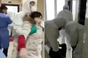 Several people have been seen violently dragged by Chinese officials to be quarantined over fears of the deadly coronavirus in new footage that surfaced online, according to a report.