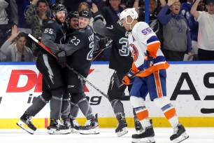 Lightning players celebrate a goal as Johnny Boychuk skates by during the Islanders' 3-1 loss on Saturday.