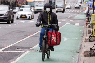 A delivery cyclist for GrubHub