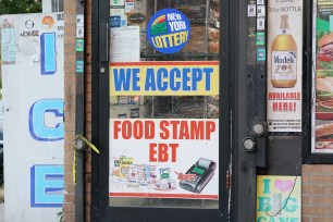 A general view of a We Accept Food Stamp EBT sign in the Bronx, NY.
