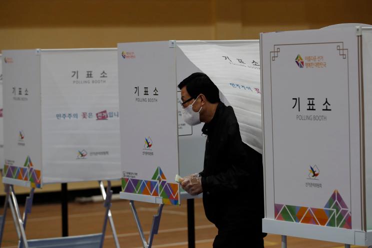 A voter wears a face mask in South Korea