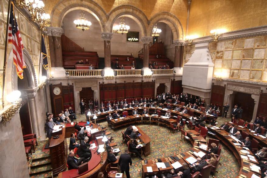 Members of the New York Senate vote for the Child Victims Act in the Senate Chamber.