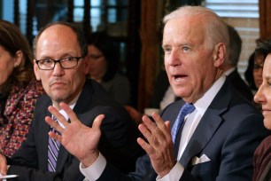 Tom Perez (left) with Joe Biden during an Obama administration cabinet member meeting in 2014