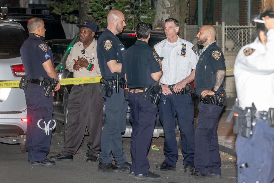 Police respond to the scene of the shooting in Brownsville, Brooklyn.