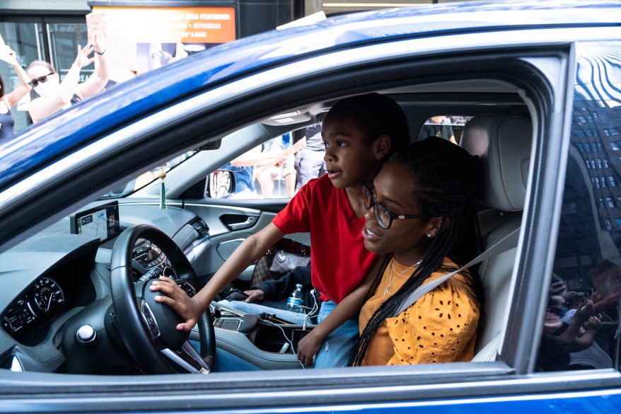 A boy honks the horn in solidarity with marchers, as thousands protest the death of George Floyd who died while being forcible detained by Minneapolis police on May 25, 2020.