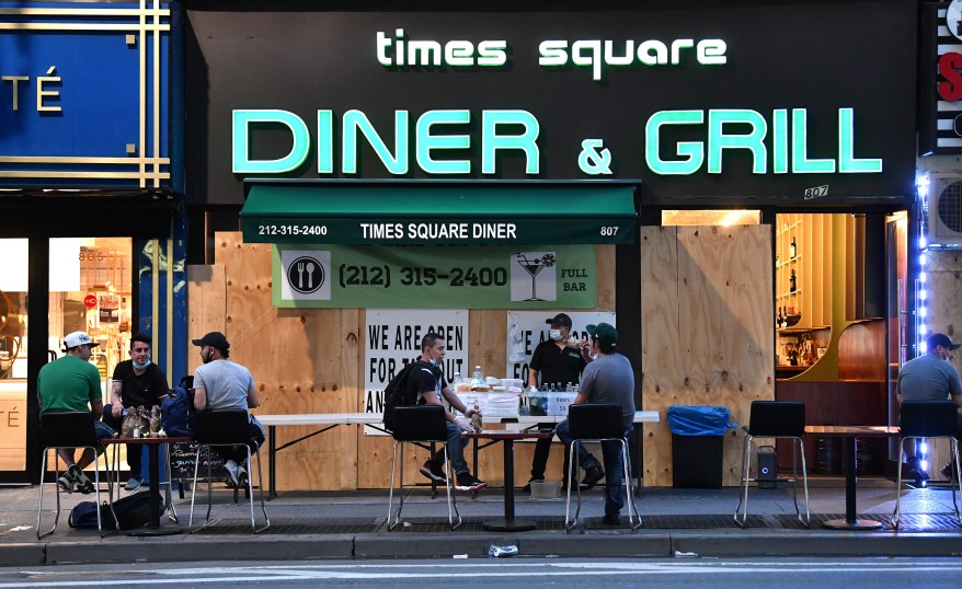 Customers outside the Times Square Diner & Grill on June 6, 2020.