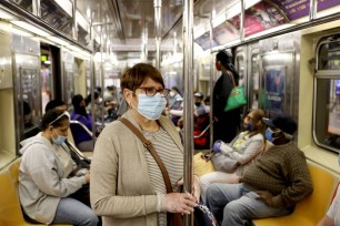 Subway riders at the 42nd Street 7th Avenue train line in Manhattan.