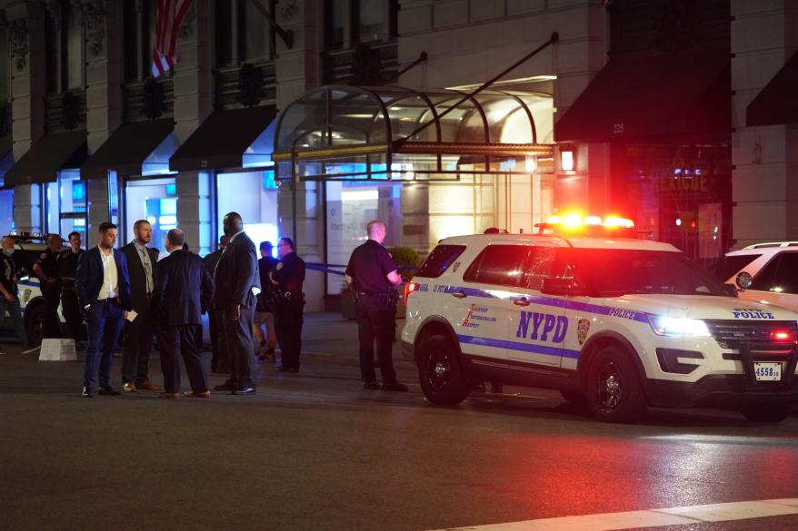 Police at the scene where two people were shot on Fifth Avenue and East 26th Street