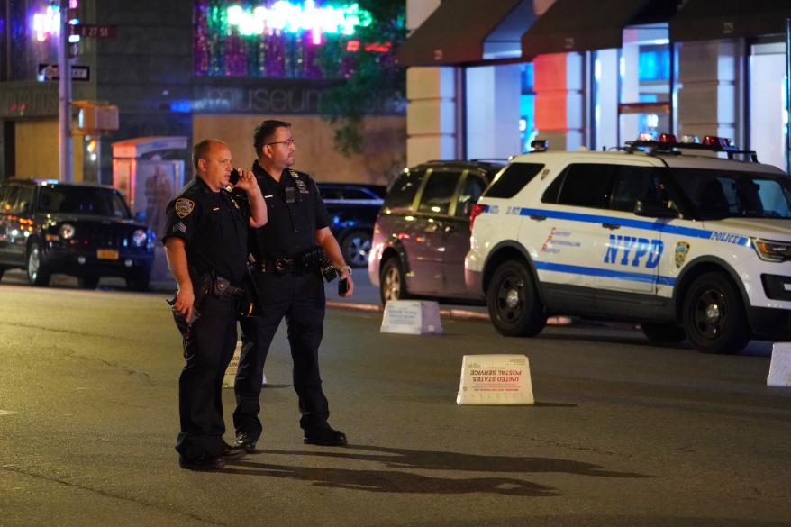 Police at the scene where two people were shot on Fifth Avenue and East 26th Street