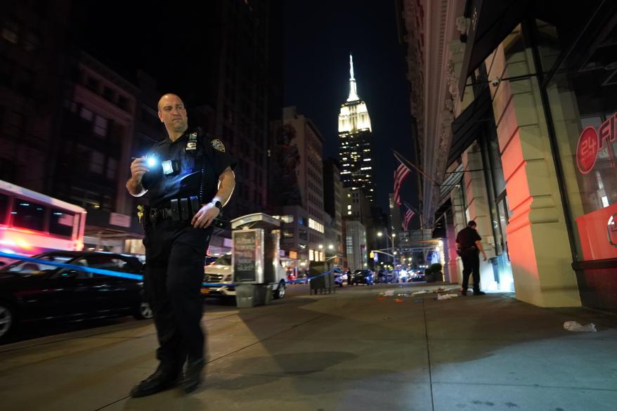 Police at the scene where two people were shot on Fifth Avenue and East 26th Street