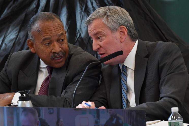 Deputy commissioner Benjamin Tucker (left) and Mayor Bill de Blasio (right)