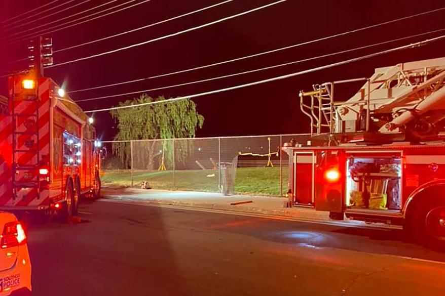 Police respond to the scene of a car crash at a golf course pond in Utah.