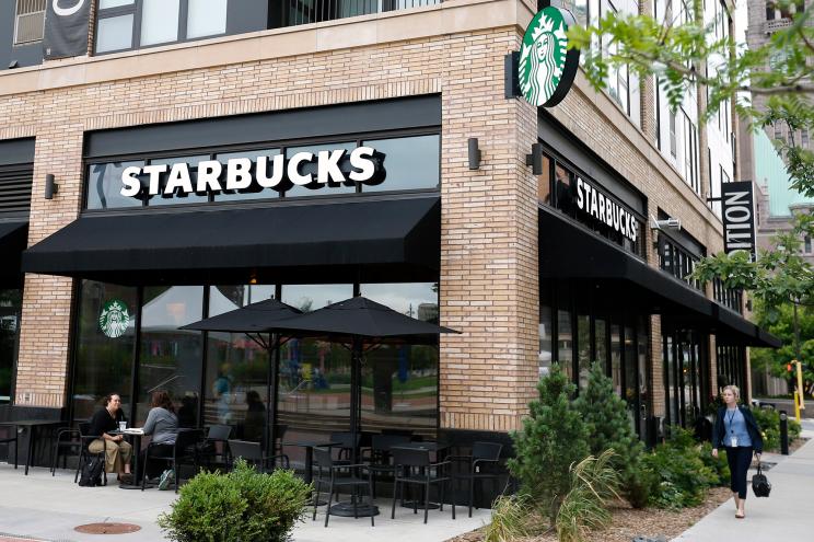 Customers visit at a Starbucks in Minneapolis.