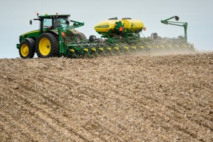 A farmer plants soybeans in a field in Springfield, Nebraska.