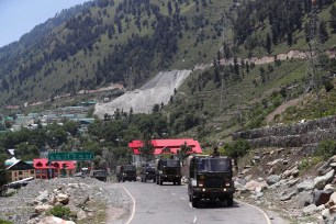 Indian army trucks move along a highway leading to Ladakh on Wednesday.