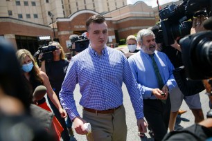 Atlanta police officer Devin Brosnan is surrounded by media following his release from the Fulton County Jail last week.