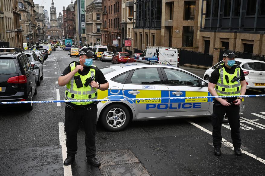 Emergency responders near the scene of a stabbing in Glasgow, Scotland.