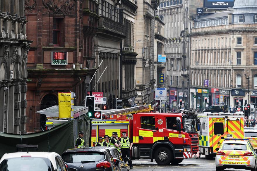 Emergency responders near the scene of a stabbing in Glasgow, Scotland.