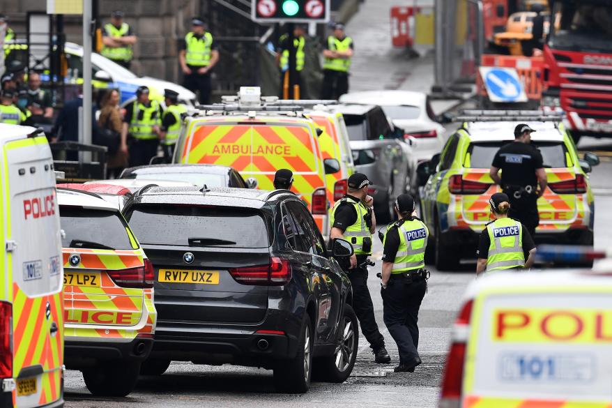 Emergency responders near the scene of a stabbing in Glasgow, Scotland.