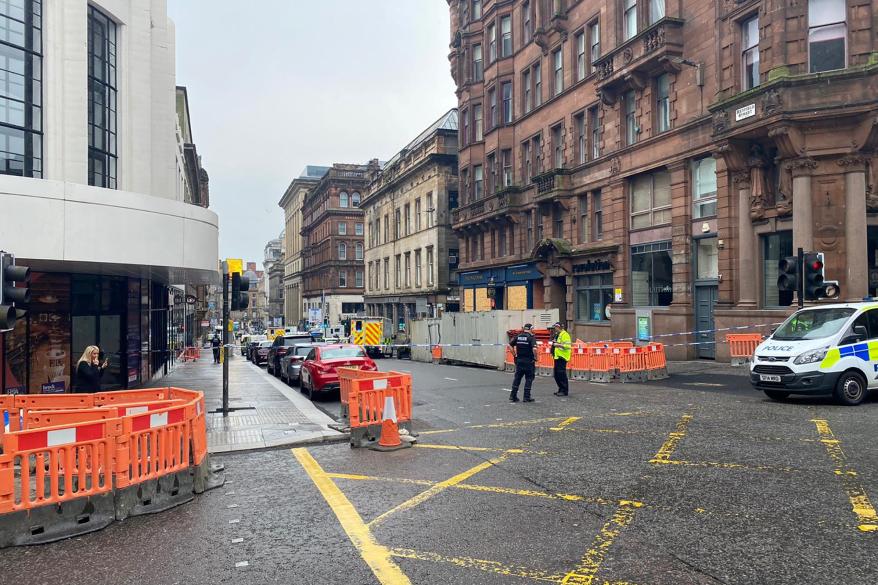 Emergency responders near the scene of reported stabbings, in Glasgow, Scotland.