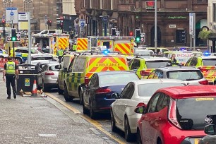 Emergency responders near the scene of a stabbing in Glasgow, Scotland.