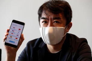 Japanese startup Donut Robotics' CEO Taisuke Ono shows the c-mask and its mobile phone application during a demonstration in Tokyo, Japan.