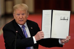 U.S. President Donald Trump signs Executive Order designed to replace degree-based hiring with skills based hiring, at the American Workforce Policy Advisory Board Meeting at the White House in Washington on June 26, 2020