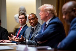 Executive Director of the White House Opportunity and Revitalization Council Scott Turner speaks as U.S. President Donald Trump and senior adviser Jared Kushner.