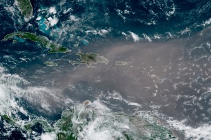 This satellite photo provided by the National Oceanic and Atmospheric Administration, NOAA, shows a could of dust coming from the Sahara desert arriving to the Caribbean.