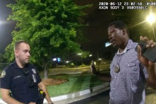 This screen grab taken from body camera video provided by the Atlanta Police Department shows Rayshard Brooks speaking with Officer Garrett Rolfe.