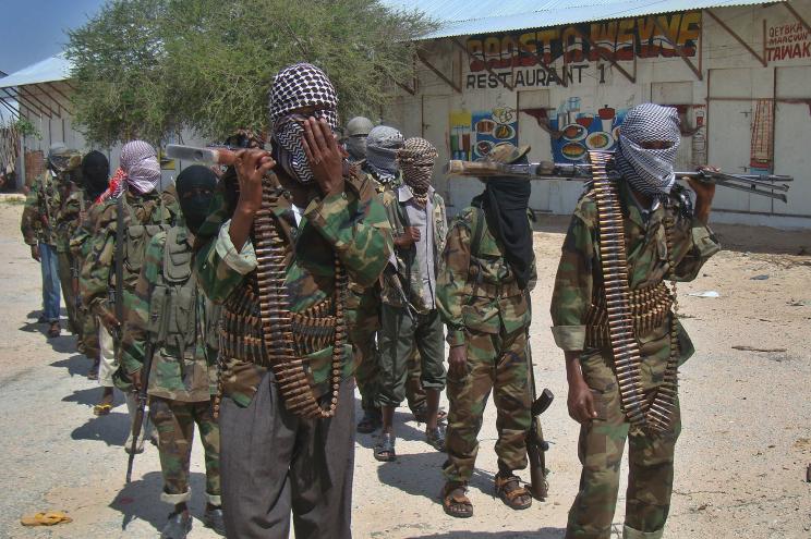 Al-shabab recruits walk down a street in the Deniile district of Somalian capital, Mogadishu.