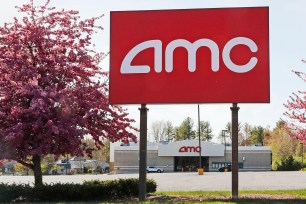 An AMC theater sign in a nearly empty parking lot in Londonderry, N.H.