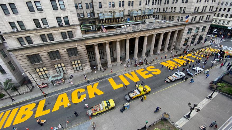 An aerial view of the Black Lives Matter street painting happening outside Brooklyn's Borough Hall