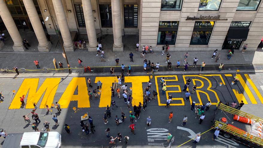 An aerial view of the Black Lives Matter street painting happening outside Brooklyn's Borough Hall