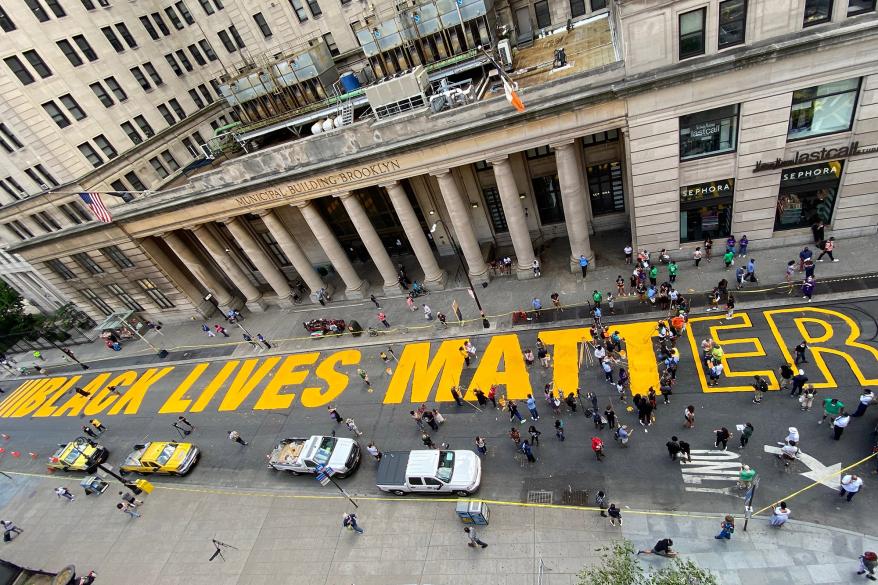 An aerial view of the Black Lives Matter street painting happening outside Brooklyn's Borough Hall