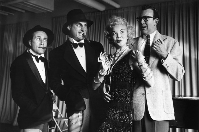 Howard Morris, Sid Caesar, Nanette Fabray and Carl Reiner posing in costume during a rehearsal for the television series, 'Caesar's Hour'.