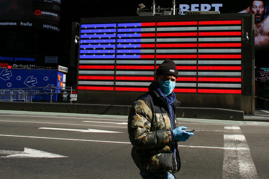 A man wears a face mask in Times Square, New York City.