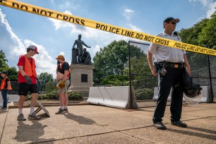 Barriers are erected around the Emancipation Memorial in Washington, which depicts a freed slave kneeling at the feet of President Abraham Lincoln.